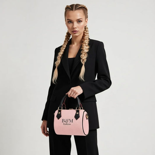 Woman holding a pink handbag with 'B&M' branding against a plain background