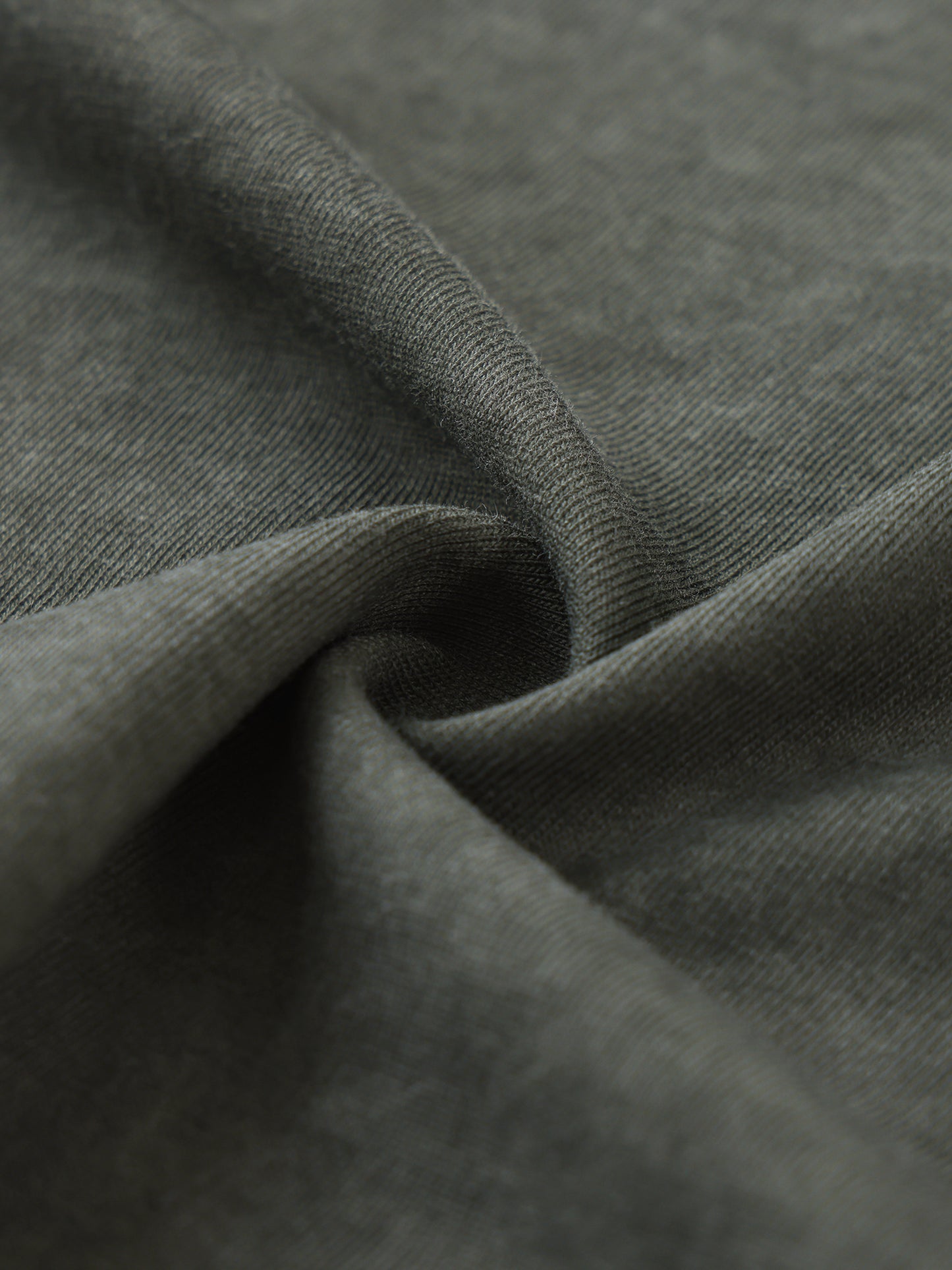 Close-up of fabric and bold design details on men's sleeveless t-shirt with comfort fit