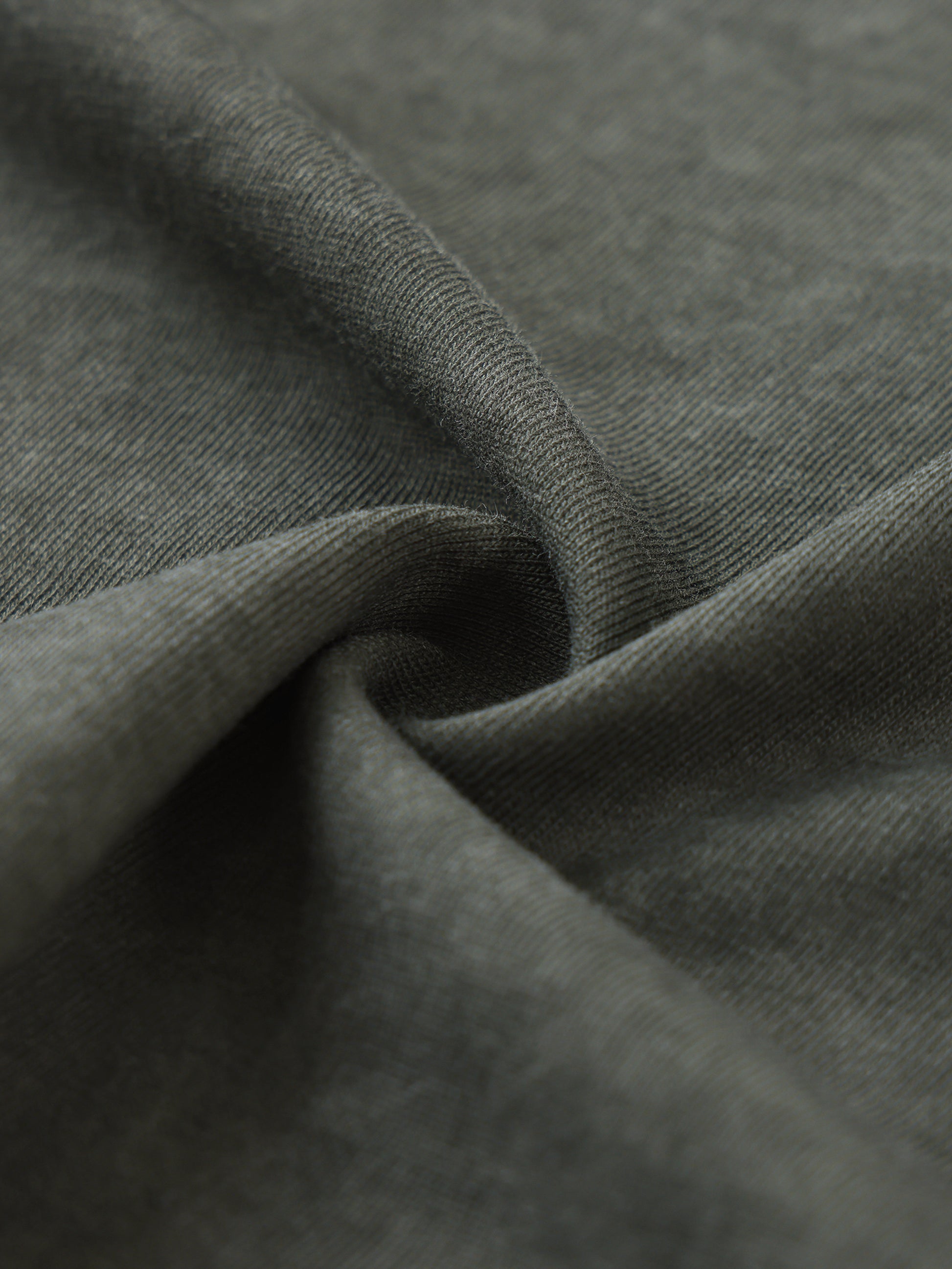 Close-up of fabric and bold design details on men's sleeveless t-shirt with comfort fit